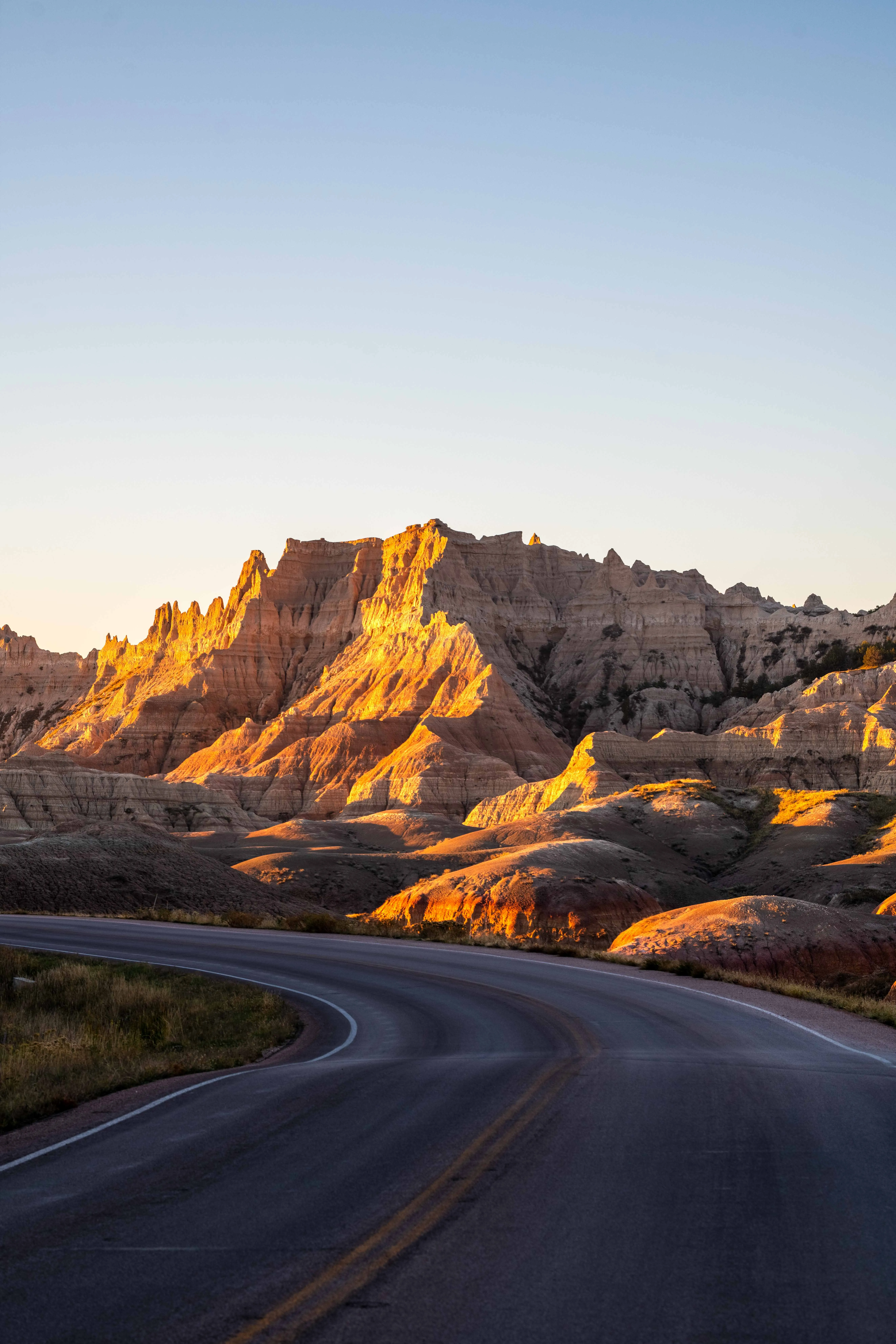 Thomas McClure landscape photography of a winding boardwalk path through layered rock formations in Badlands National Park South Dakota