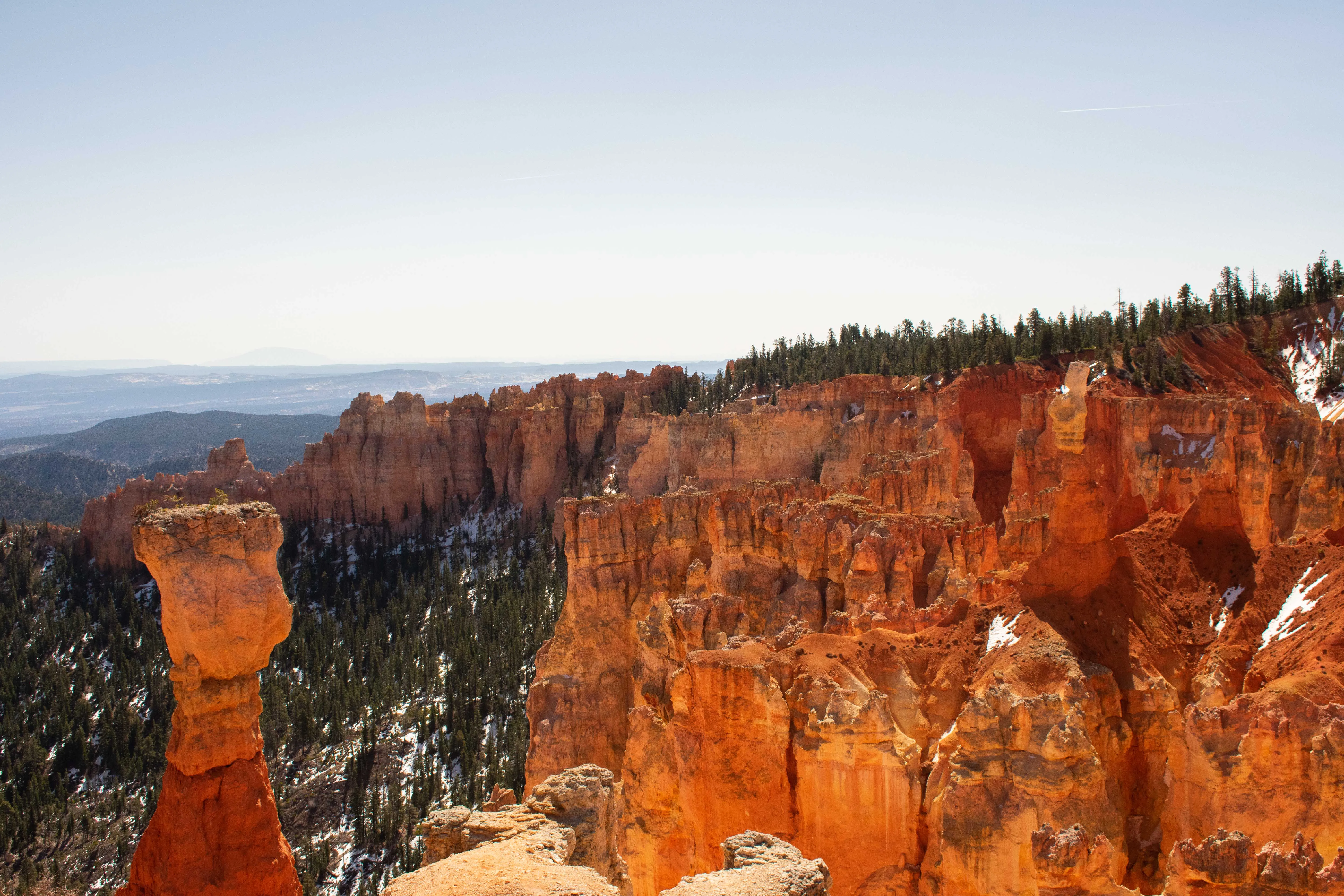 High contrast landscape photography by Thomas McClure of red rock hoodoos and shadows in Bryce Canyon National Park Utah