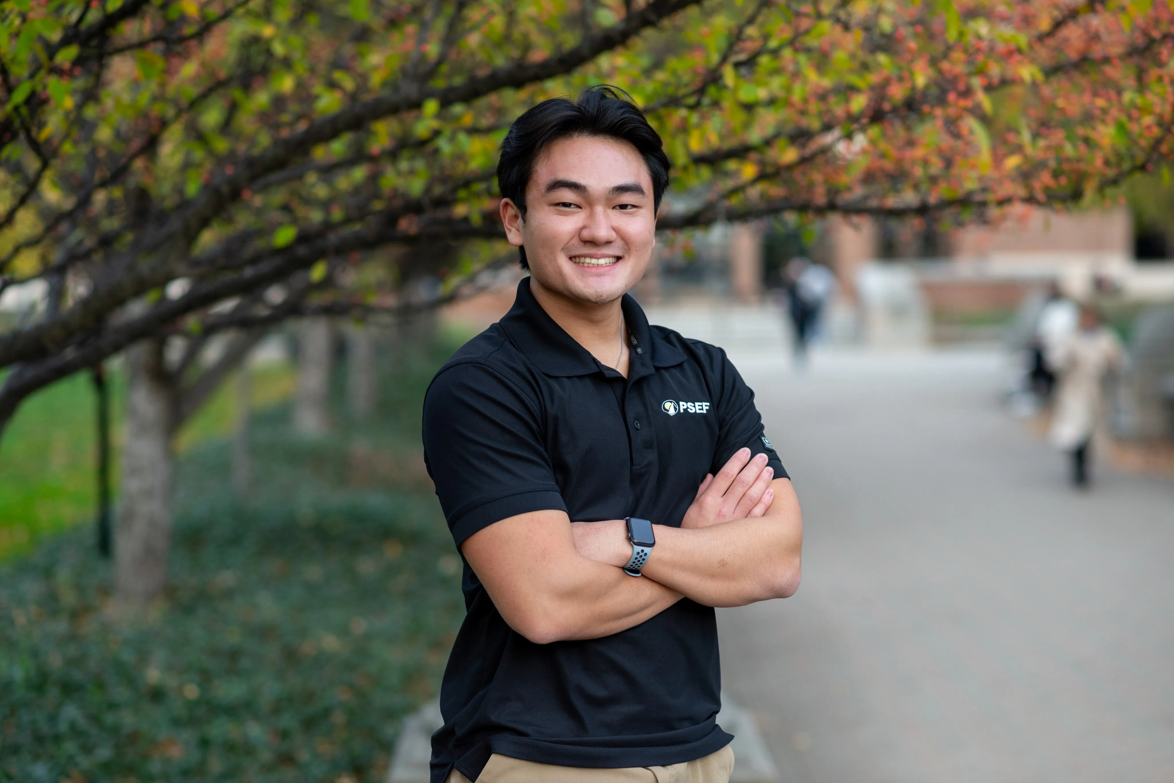 Chicago Photographer Thomas McClure outdoor portrait of smiling young man with blurred background in West Lafayette