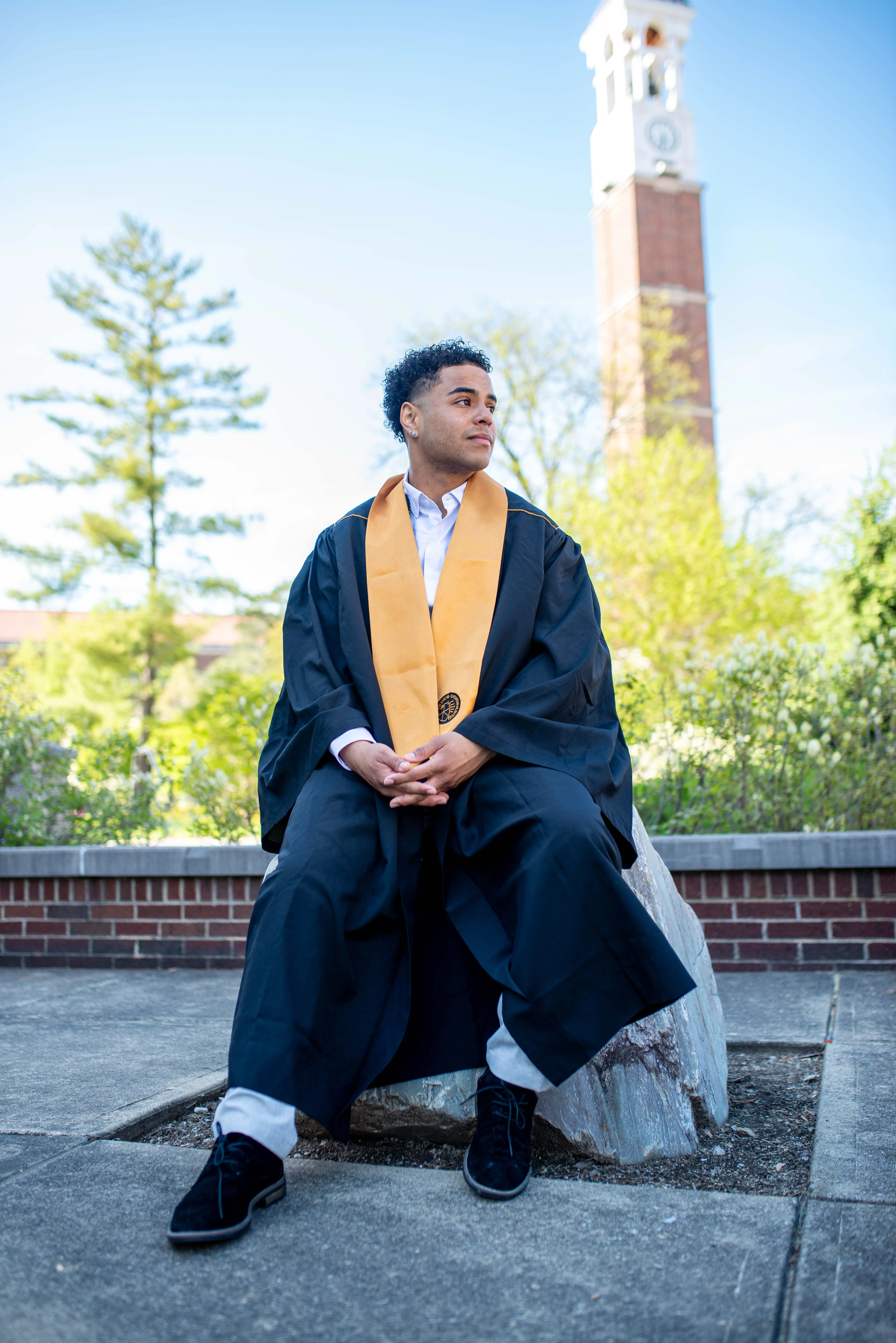Professional low angle portrait photography by Thomas McClure of a man in a suit posing in West Lafayette Indiana