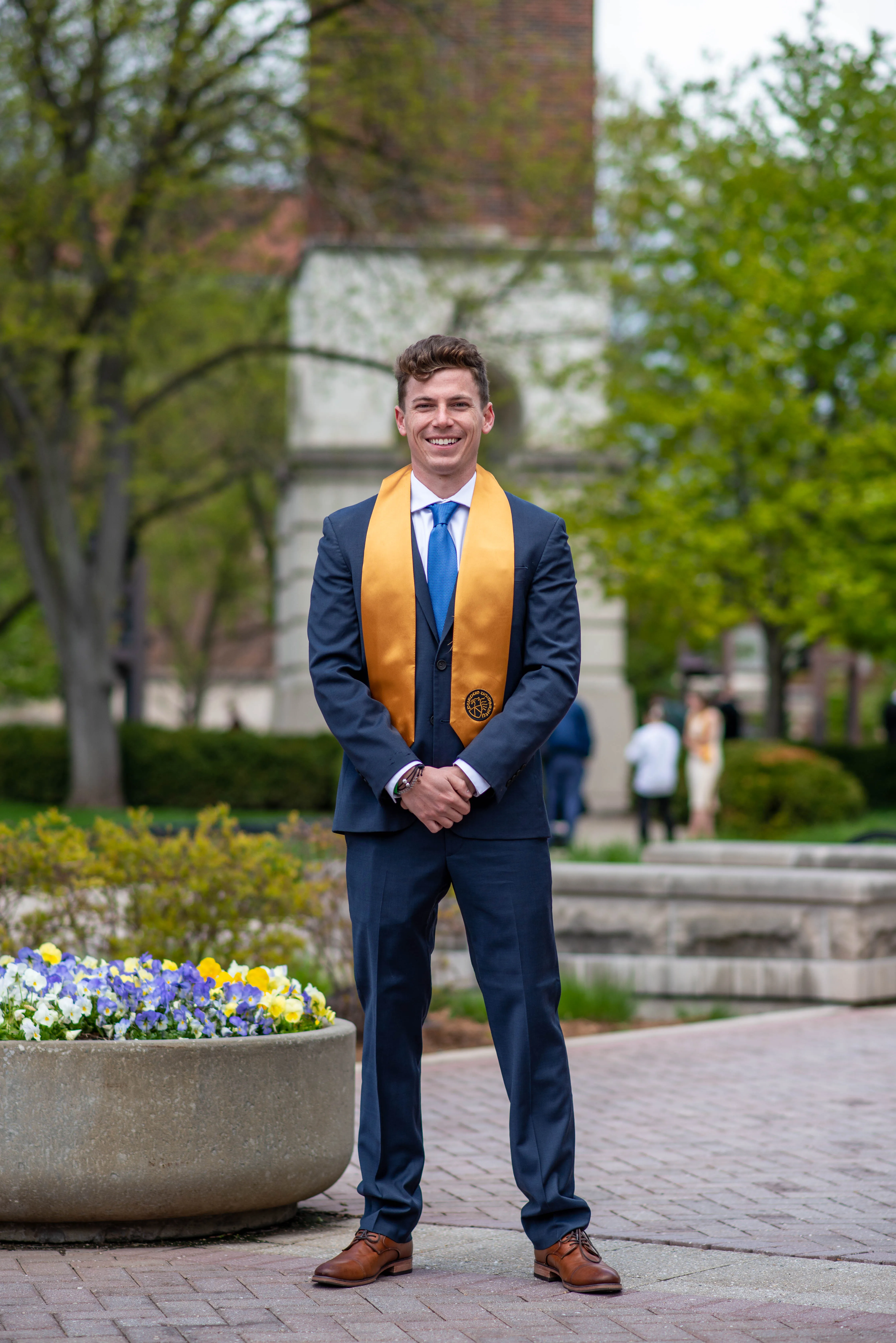 Urban geometry portrait photography by Thomas McClure of a man on concrete steps in West Lafayette Indiana
